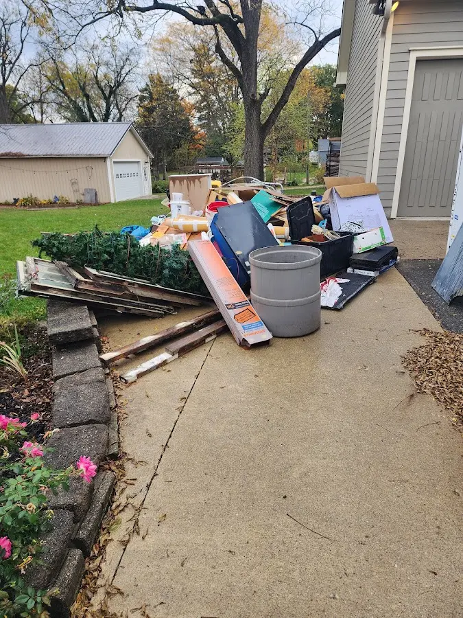 Dumpster being loaded with debris for Roofing Dumpster Rental in Winthrop Harbor